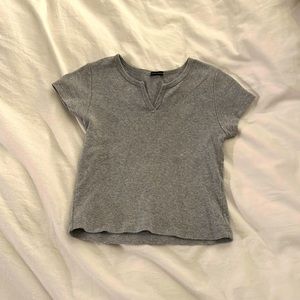 This is a cropped tight fitted Brandy Melville shirt, in perfect condition.